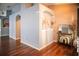 Elegant entryway featuring hardwood floors, neutral paint, and arched doorways at 11567 Misty Isle Ln, Riverview, FL 33579
