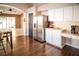 Kitchen area featuring stainless steel refrigerator and view into another room at 11567 Misty Isle Ln, Riverview, FL 33579