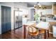 Well-equipped kitchen featuring stainless steel appliances, white cabinets, and a stylish breakfast nook at 11567 Misty Isle Ln, Riverview, FL 33579