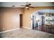 Open floorplan view into kitchen and stainless steel refrigerator from living area at 11567 Misty Isle Ln, Riverview, FL 33579