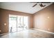 A living room with sliding glass doors leading to an outdoor space at 11567 Misty Isle Ln, Riverview, FL 33579
