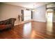 Spacious living room with hardwood floors, plantation shutters, and ample natural light at 11567 Misty Isle Ln, Riverview, FL 33579
