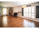 Bright and airy living room featuring hardwood floors, neutral walls, and updated fixtures at 11567 Misty Isle Ln, Riverview, FL 33579