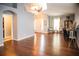 Open-concept living area with hardwood floors and a seamless flow to the entryway at 11567 Misty Isle Ln, Riverview, FL 33579
