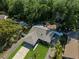 Overhead view of a home showing the layout, yard, surrounding trees, and driveway at 13411 Whitby Rd, Hudson, FL 34667