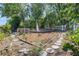 The landscaped backyard offers lots of space and includes a wooden fence at 13411 Whitby Rd, Hudson, FL 34667