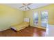Bright bedroom with lots of natural light and hardwood floors at 13411 Whitby Rd, Hudson, FL 34667