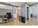 Open living space featuring wood-look tile flooring and views into a dining area with a pantry at 13411 Whitby Rd, Hudson, FL 34667