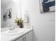 Clean bathroom featuring a single sink with a marble countertop and minimalist decorations at 2764 Walden Town Cir, Plant City, FL 33566