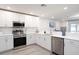 The kitchen boasts modern appliances, white cabinets, and bright countertops at 2764 Walden Town Cir, Plant City, FL 33566