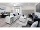 Living room featuring a sofa, arm chairs, side table, television, rug and a dining area at 2764 Walden Town Cir, Plant City, FL 33566