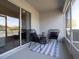 Cozy patio features stylish chairs, a small table, and a checkered rug for relaxing outdoor enjoyment at 2764 Walden Town Cir, Plant City, FL 33566
