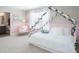 Bright bedroom featuring a charming canopy bed, soft pink accents, and a decorative floral theme at 2770 Walden Town Cir, Plant City, FL 33566