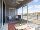 Relaxing screened-in patio with stylish seating, outdoor rug, and views of the surrounding community at 2770 Walden Town Cir, Plant City, FL 33566