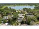 Aerial view of the property showcasing the house, pool, lake access, and surrounding community at 2872 Hammock Dr, Plant City, FL 33566