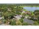 Aerial view of the property showcasing the house, lake access, and surrounding community at 2872 Hammock Dr, Plant City, FL 33566