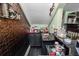 Home bar area features a metallic backsplash, black counter, and a sink at 2872 Hammock Dr, Plant City, FL 33566