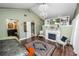 Cozy bedroom with fireplace, decorative chandelier, and custom trim and finishes at 2872 Hammock Dr, Plant City, FL 33566
