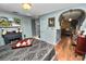 Bedroom with a fireplace, arched entry, and wall details at 2872 Hammock Dr, Plant City, FL 33566