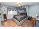 Well-appointed bedroom features an ornate ceiling and hardwood floors at 2872 Hammock Dr, Plant City, FL 33566