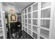 Walk-in closet featuring custom storage and a view into the bathroom at 2872 Hammock Dr, Plant City, FL 33566