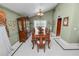 Spacious dining room featuring a large table with seating for ten and a beautiful chandelier at 2872 Hammock Dr, Plant City, FL 33566
