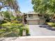 Charming two-story home with a spacious three-car garage and a well-maintained lawn at 2872 Hammock Dr, Plant City, FL 33566