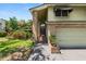 Charming home featuring a brick and siding exterior, covered entryway, and lush landscaping at 2872 Hammock Dr, Plant City, FL 33566