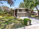 Charming two-story home features a brick facade, attached garage, and verdant front yard at 2872 Hammock Dr, Plant City, FL 33566