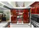 Spacious kitchen with custom cabinets, stainless steel appliances, and built-in desk area at 2872 Hammock Dr, Plant City, FL 33566