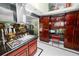 Kitchen features stainless steel appliances, custom cabinets, and adjacent breakfast nook at 2872 Hammock Dr, Plant City, FL 33566