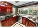 Kitchen features stainless steel appliances, granite countertops, and a bright window overlooking the yard at 2872 Hammock Dr, Plant City, FL 33566