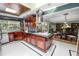 Beautiful kitchen with stainless steel appliances, custom cabinets, and adjacent breakfast nook at 2872 Hammock Dr, Plant City, FL 33566