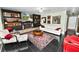 Spacious living room boasts a fireplace, comfortable seating, and elegant rug at 2872 Hammock Dr, Plant City, FL 33566