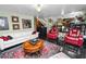 Spacious living room with red accents, featuring an elegant rug and comfortable seating at 2872 Hammock Dr, Plant City, FL 33566