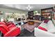 Bright living area boasts a fireplace, comfortable seating, and seamless access to the outdoor pool area at 2872 Hammock Dr, Plant City, FL 33566