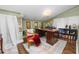 Home office with an oversized desk, decorative rug, and a chair with a blanket at 2872 Hammock Dr, Plant City, FL 33566
