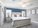 Primary bedroom showcasing a large bed, neutral walls, and plenty of natural light at 6957 161St E Ter, Parrish, FL 34219