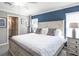 Spacious bedroom featuring a decorative accent wall and a large window for natural light at 6957 161St E Ter, Parrish, FL 34219