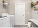 Well-organized laundry room with modern appliances and ample storage space at 6957 161St E Ter, Parrish, FL 34219