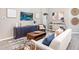 Cozy living room with stylish furnishings, a modern entertainment center, and neutral decor at 6957 161St E Ter, Parrish, FL 34219