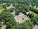 An aerial view of the property shows several sheds, trailers and mature trees at 7608 Franklin Rd, Plant City, FL 33565
