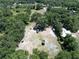 Aerial view of a large property with multiple structures and wooded areas at 7608 Franklin Rd, Plant City, FL 33565