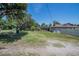 Expansive backyard with a screened enclosure and mature trees, offering privacy and outdoor enjoyment at 7608 Franklin Rd, Plant City, FL 33565