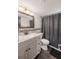 Well-maintained bathroom featuring granite countertops, modern fixtures, and a shower-tub combo at 7608 Franklin Rd, Plant City, FL 33565
