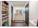 Bathroom with a large vanity with drawers and an open closet space for storage at 7608 Franklin Rd, Plant City, FL 33565