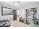 Nicely decorated Bedroom with stylish decor, featuring a crib, and comfortable seating at 7608 Franklin Rd, Plant City, FL 33565