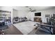 Bonus room with a television, weights, and a cage for dogs or other pets at 7608 Franklin Rd, Plant City, FL 33565