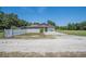 Well-maintained exterior of a home featuring a fenced yard and a peaceful setting at 7608 Franklin Rd, Plant City, FL 33565