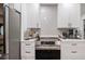 Contemporary kitchen design with white cabinets, stainless steel appliances, and sleek countertops at 7608 Franklin Rd, Plant City, FL 33565